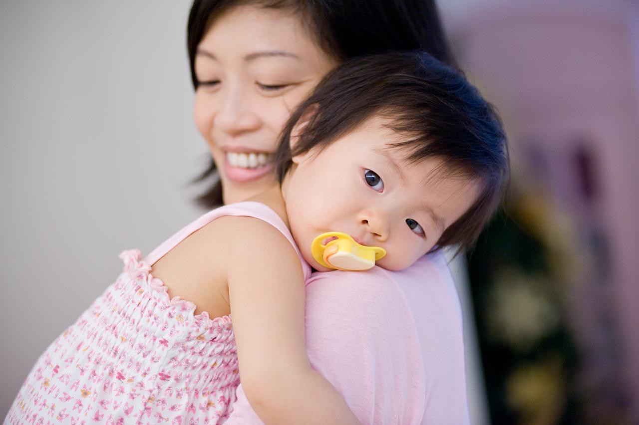 A mother holding her baby in a photograph from the founder’s story